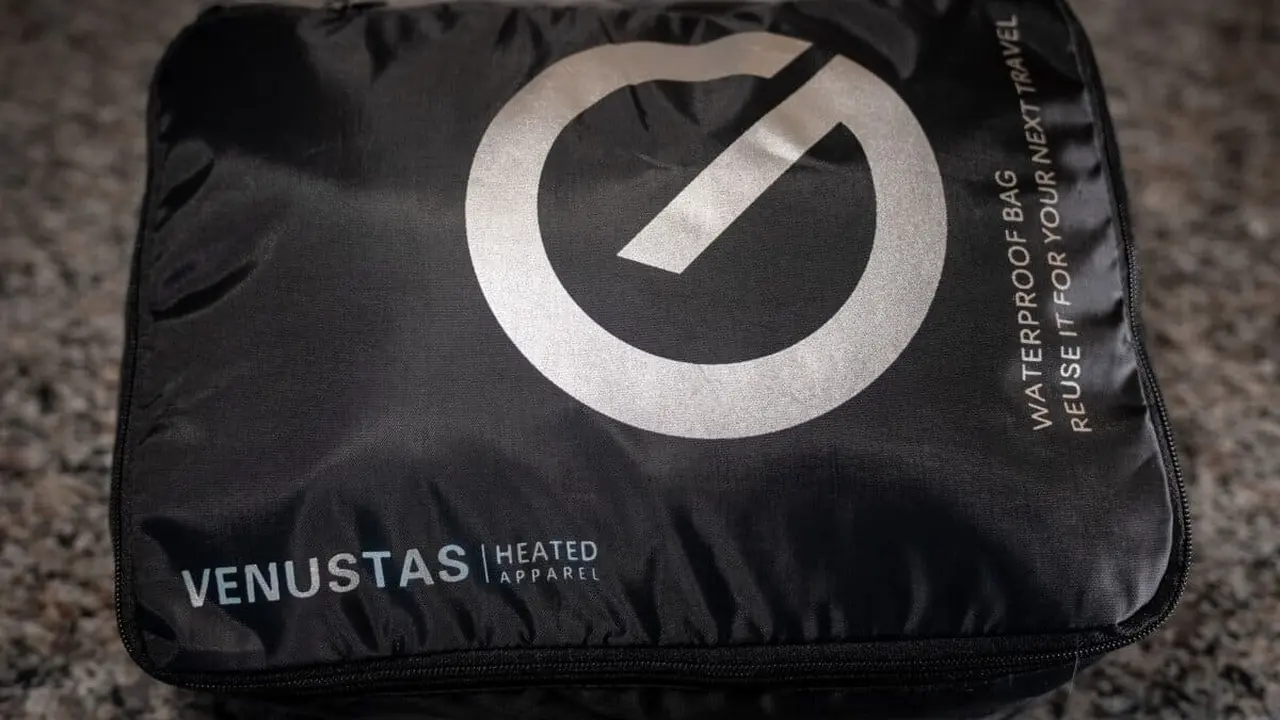 Close up on a plate of mashed potatoes, topped with baked pork chops with cream of mushroom soup, and a side of green beans.