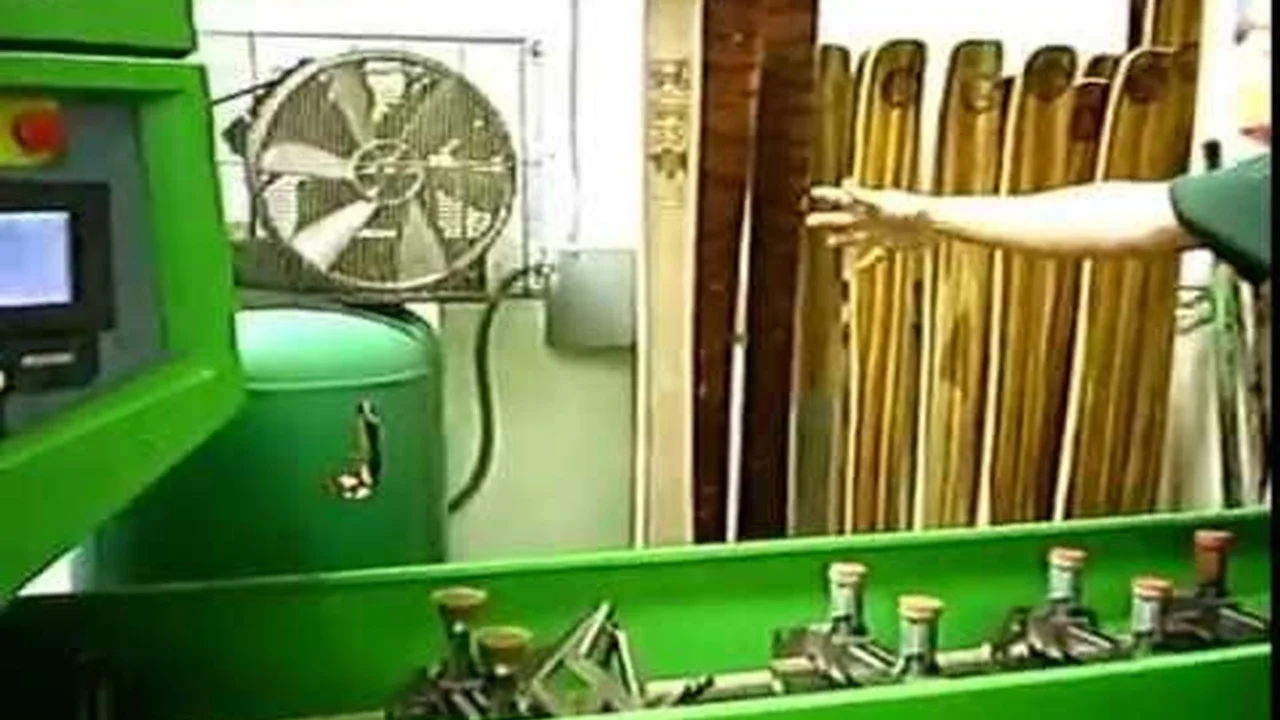 Close up on a plate of mashed potatoes, topped with baked pork chops with cream of mushroom soup, and a side of green beans.