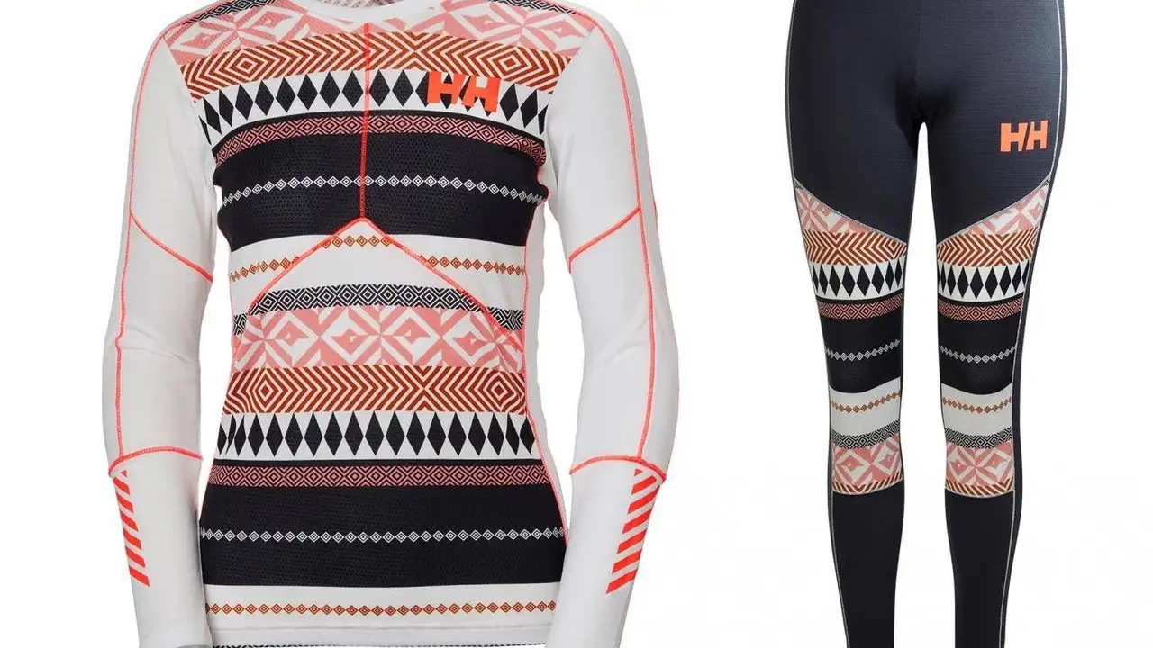 blue bowl of black bean beef tortilla soup on a board with cilantro and shredded cheese in background