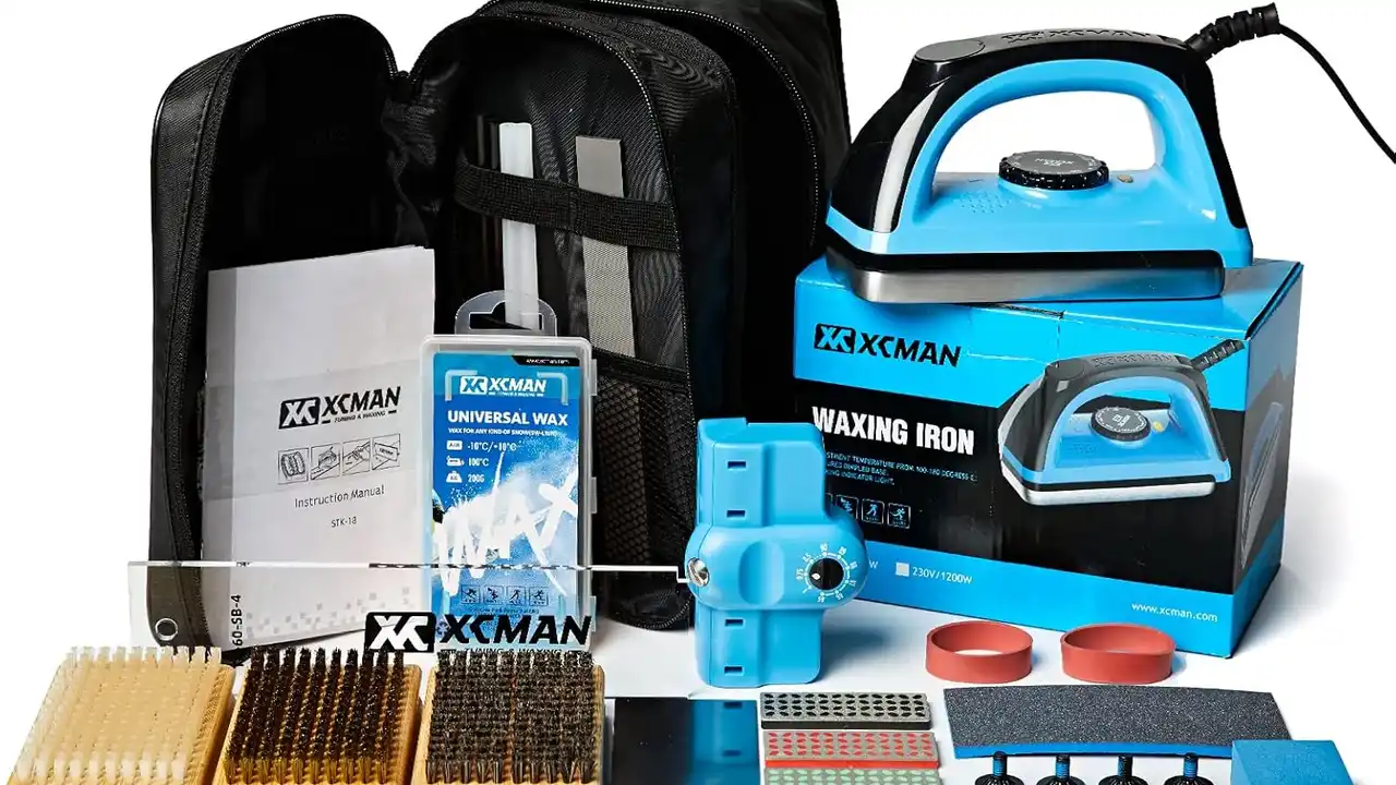 blue bowl of black bean beef tortilla soup on a board with cilantro and shredded cheese in background