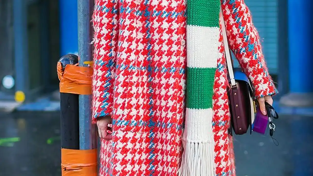 Close up on a plate of mashed potatoes, topped with baked pork chops with cream of mushroom soup, and a side of green beans.