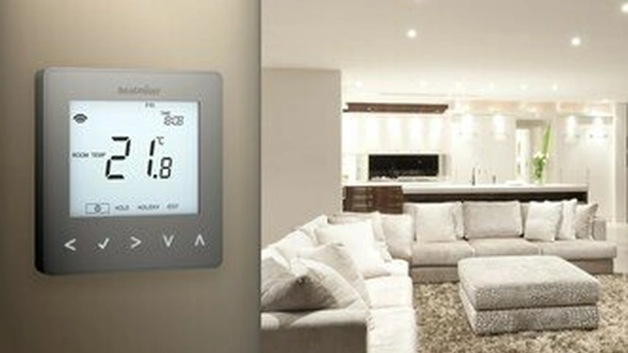 Close up on a plate of mashed potatoes, topped with baked pork chops with cream of mushroom soup, and a side of green beans.